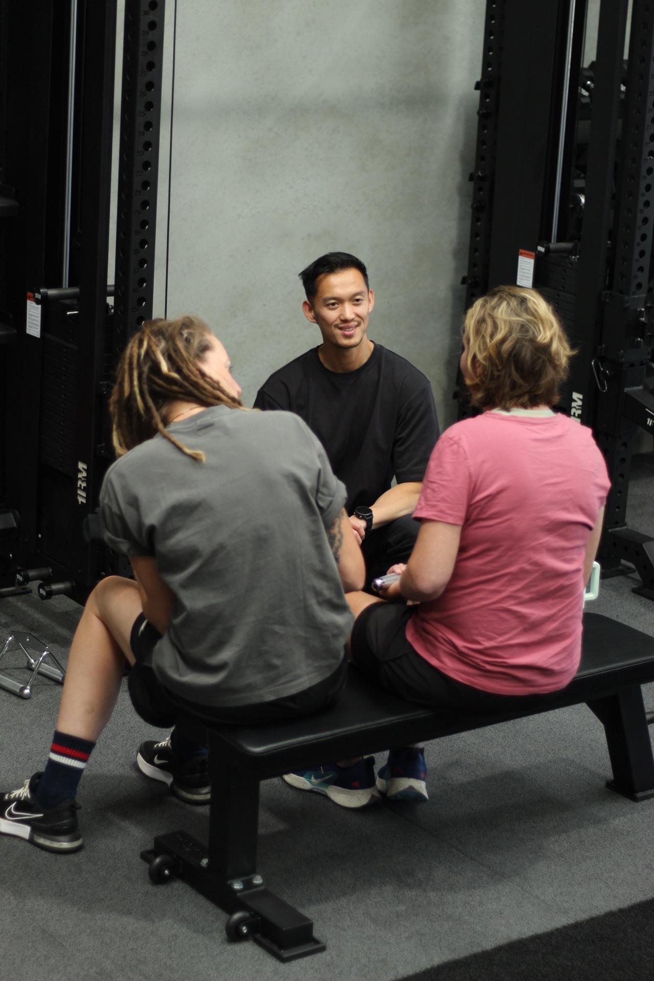 A support worker guiding a participant through an exercise