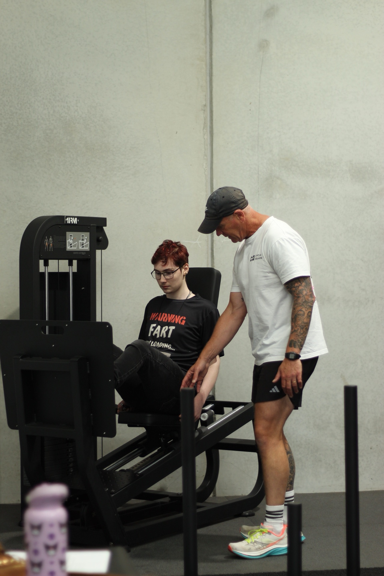 A trainer assisting a participant